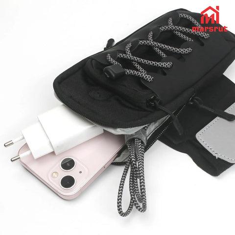 Ride Ready Front Battery Frame Cover Storage Bag For Electric Dirt Bikes And Ebikes Fits Surron, showing pockets open with phone and charger