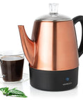 4 Cup Electric Percolator Coffee Pot With Keep Warm Function In Copper And Stainless Steel next to a glass cup of coffee