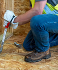 Builder using Little PeeVee Sill Plate Tool For Construction Walls, 18 Inch Length Steel Puller With Ergonomic Grip on plywood floor