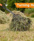 Wide Head Pitch Fork For Manure And Hay, Beefy Heavy Duty 14.96 Inch Head With 10 Tines in use with fibrous hay pile