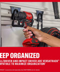 Compact Brushless Cordless Drill And Impact Driver Combo Kit Featuring Dual Amp Batteries And Rapid Charger Pro Grade High Torque Power Tools in use on Versatrack wall.