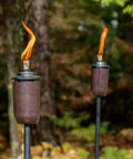 2-Pack Honey Copper Outdoor Torches For Patio Backyard And Garden No-Fuss Ready-To-Go Easy-Install Tiki Style Torches In Use