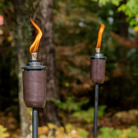 2-Pack Honey Copper Outdoor Torches For Patio Backyard And Garden No-Fuss Ready-To-Go Easy-Install Tiki Style Torches In Use