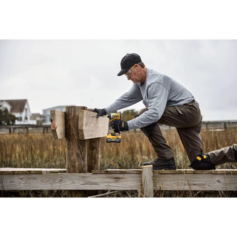 Man using 20V Max XR Cordless Impact Driver Bare Tool With 1 Quarter Inch Hex Chuck High Torque Beast For Tough Jobs
