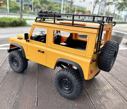One Twelfth RC Crawler MN98 Remote Control Truck Off Road Four By Four Land Rover Defender Style showing rear and side view