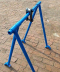 Driveway Ready Heavy Duty Foldable Engine Hoist Crane Lifter With 2200 Lbs Capacity showing blue carbon steel frame on a brick surface.