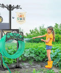 Heavy Duty Free Standing Garden Hose Holder Stand With Two Shepherd Hooks Detachable Metal Hose Storage Rack in use outdoors