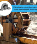 Pillow block bearing installed on wooden water-wheel frame; 3/8 in / 10 mm bore, zinc alloy steel housing.