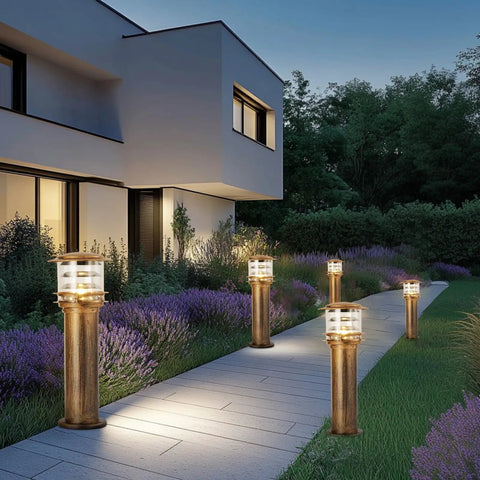 Weatherproof Aluminum Post Cap Lights For Deck And Yard With Bright Acrylic Diffuser illuminating a garden pathway at dusk.