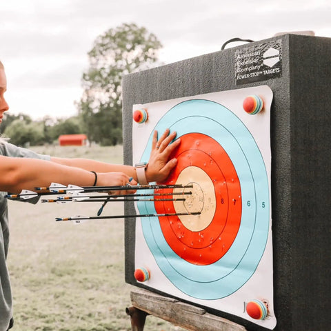 Archer practicing with 24 Inch Pro Series Big Block Foam Archery Target For Broadheads And Field Tips Ultra Durable High Density Foam