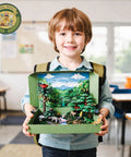 Child holding Rainforest Diorama Kit With 33 Pieces PVC Animals And Insects, Miniature Trees, Moss, Sand, Stones, and Backdrop