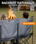 People sitting on Three Person Padded Camping Chair Loveseat, facing a campfire, emphasizing neck support feature.