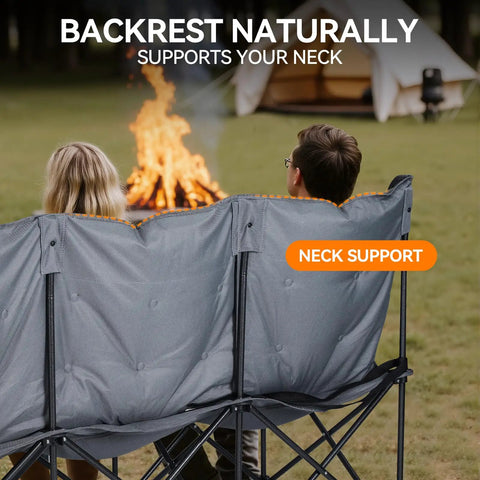 People sitting on Three Person Padded Camping Chair Loveseat, facing a campfire, emphasizing neck support feature.