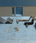 PRL4 Panelboard Connector Kit For Single Mounted Breakers KD KDB HKD KDC, metal components and screws on blue surface