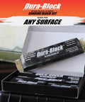 Open box showing contents of Six Piece Flexible EVA Foam Auto Body Sanding Block Kit for Wet or Dry Sanding, on a workbench.
