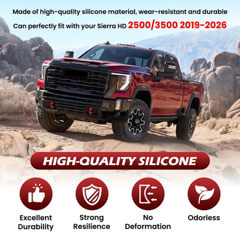 Red Tow Hook Covers for GMC Sierra HD 2500 And 3500 2019 Through 2026 shown on a red truck in a rugged outdoor setting.