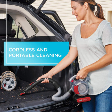 Woman using Cordless Car Vacuum With Extendable 4 Foot Hose And Detailing Kit on SUV trunk, highlighting portable cleaning.
