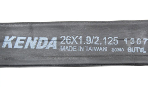 Close-up of a black Kenda tube labeled 26x1.9/2.125, fitting 26-inch MTB tires, part of Bulk Two Pack 26 By 1.90 To 2.125 Inner Tubes For Mountain Bikes With Schrader Valves Black Fits 26 Inch MTB Tire Size Range No Retail Packaging Great For Daily Trail Rides And Upgrading Your MTB Tubes.