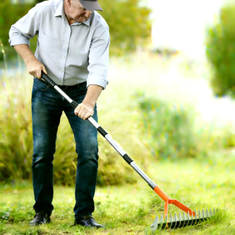 Person using All Purpose Lawn Thatch Rake With 15 Inch Head Beefy 19 Tines 68 Inch Adjustable Handle Heavy Duty Metal Dethatcher Dead Grass Remover Tool For Yards And Gardens Easy Manual Dethatching Rake For Thick Turf on grass