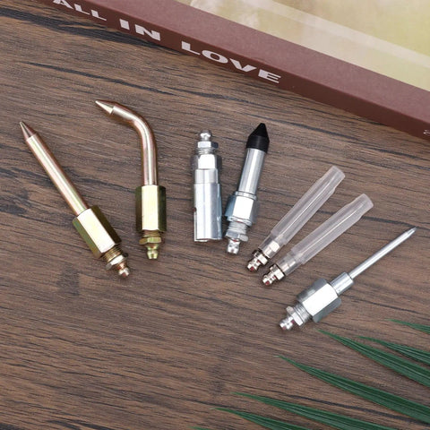 7 Piece Grease Gun Accessory Kit With 2 Grease Nozzles, 1 Needle Tip Dispenser displayed on wooden surface