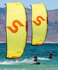 Two riders kiteboarding with Ghost V3 One Strut Kiteboarding Kite With Compact Swept Canopy For Efficient Upwind Reach, 17m yellow.