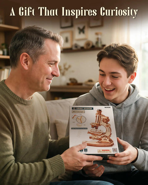 One To One Scale Wooden Puzzle Microscope Kit With 40X To 400X Magnification, Buildable 3D Replica For Adults And Teens, Educational STEM Gift, Great Desk Decor And Learning Display. Father and teen holding boxed wooden microscope kit