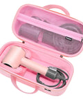 Open rose red hard travel case for Dyson hair dryer and accessories, showing shockproof shell and soft anti-static lining.