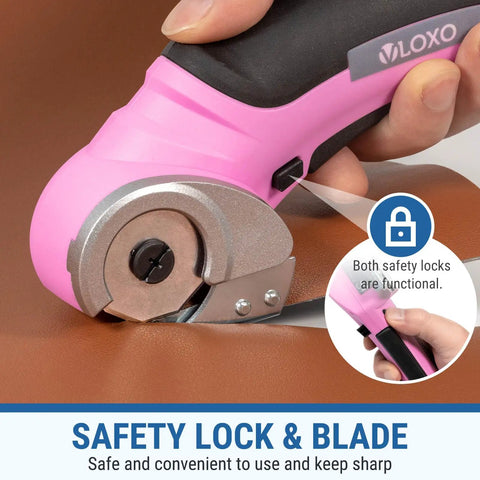 Close-up of Cordless Electric Scissors With Safety Lock cutting leather, showing pink design and blade mechanism.