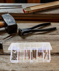 49Pc M6 Hex Socket Head Cap Screws And Barrel Nut Set, 40-80mm Lengths, in organizer box on wooden table with tools