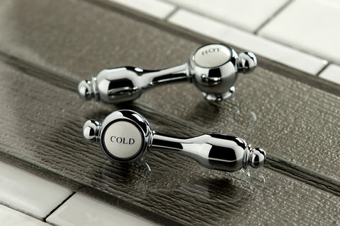 Handles of Tudor Basin Faucet in Polished Chrome Finish with Leak Free Ceramic Cartridge, Solid Brass Construction on a textured surface