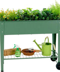 Raised Garden Bed With Legs And Wheels Removable For Outdoor Use 31.6 By 14.6 Inch Metal Planter Box filled with plants