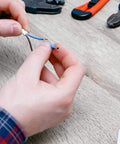 Hands assembling wires with Ferrule Crimping Tool Kit Pro Grade With Secure Wire Ferrule Nylon Case And 160 Electrical Wire Connectors