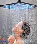 No Sweat Thermostatic Shower Faucet Kit With Led Rainfall Head And Handheld Body Massager For A Top Shelf Bathroom Fixture showing a woman under a 16 inch black LED rainfall shower head.