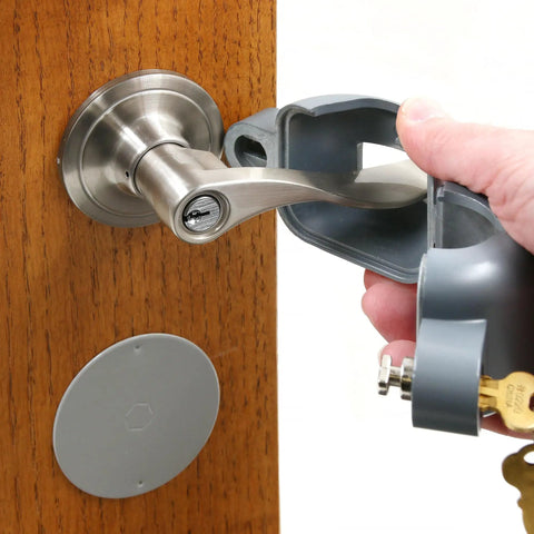 Doorknob Lock-Out Device With Key Blocks Access To The Keyhole On Round Knobs Up To Two And Seven Eighths Inches being installed