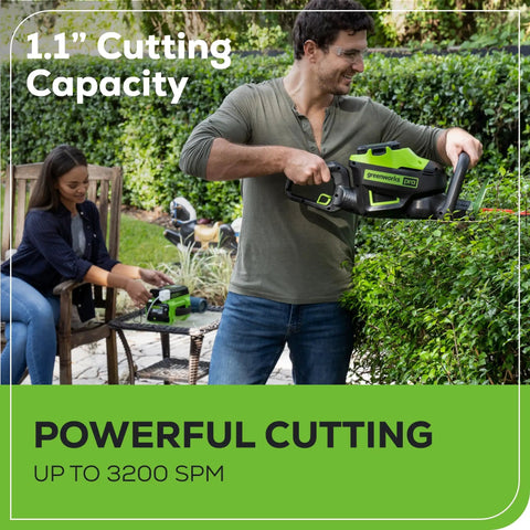 Man trimming hedge with 60V 26-Inch Brushless Cordless Hedge Trimmer With Dual-Action Laser-Cut Blades, woman in background.