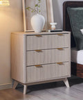 Set Of Two Fluted Nightstands Featuring Three Spacious Drawers And Clean White Alder Finish in a bedroom setting.