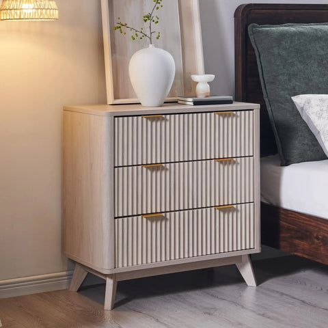 Set Of Two Fluted Nightstands Featuring Three Spacious Drawers And Clean White Alder Finish in a bedroom setting.