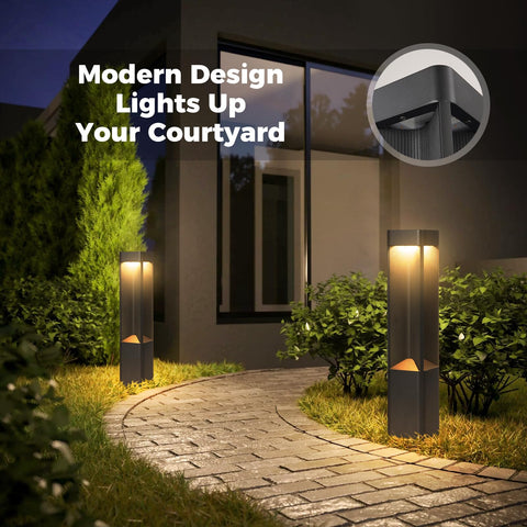 Hella Bright Black Pathway Lights Outdoor Landscape Bollard Lamps With Waterproof Led Warm Glow For Yard Glow Up Hardwired Aluminum Lawn Posts illuminating a garden pathway.