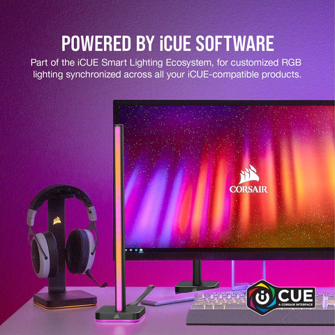 ICUE LT100 Smart Lighting Tower Starter Kit with RGB sync beside monitor, headphones on stand, showcasing diffused color effects.