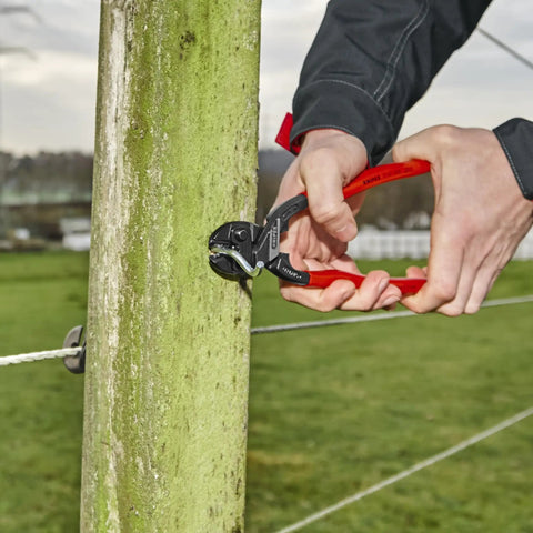 Person using CoBolt Compact Bolt Cutter 10 Inch Ultra High Leverage Tool Delivers Sixty Percent Less Effort With Induction Hardened Cutting Edges at 64 HRC