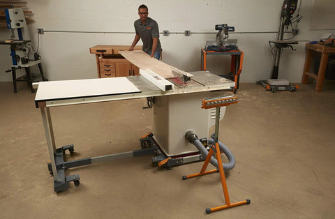 Tri Function Pedestal Roller Stand With Adjustable Height 27 To 43.75 Inches supporting wood on table saw in workshop