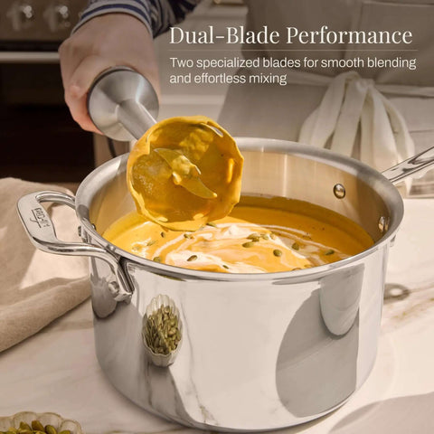 Heavy Duty Stainless Steel Immersion Blender With Kickass 600 Watt Motor And Turbo Switch Silky Smooth Blending For Soups Shakes And Baby Purees Features Variable Speed Dial Plus Detachable Shaft blending soup with dual blades in a stainless pot.