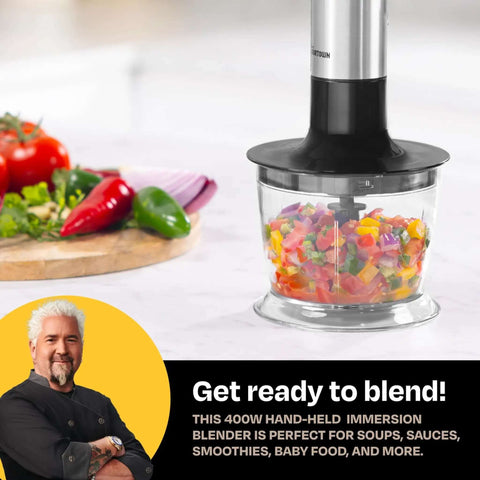Pretty Dang Powerful Immersion Blender With 400W DynamicShaft Tech blending colorful chopped vegetables for soups and sauces.