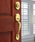 Chelsea Single Cylinder Handle Set With Lido Lever Featuring SmartKey Security, exterior deadbolt, polished brass finish on door