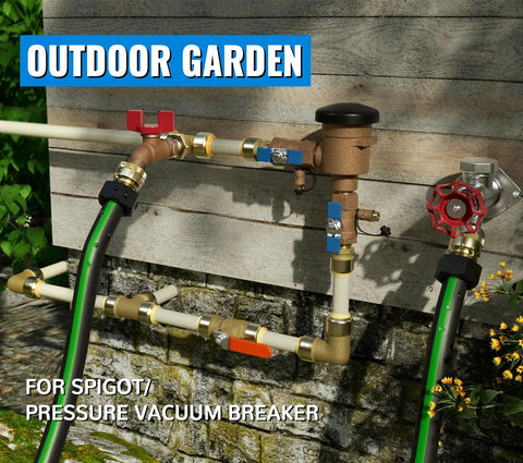 Outdoor garden setup with spigot and pressure vacuum breaker connected to hoses against wall.