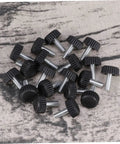 Twenty Adjustable Furniture Leveling Cups With Threaded Socket Design For Quick Install and Slick Glide Motion On Wood Tables Metal Chairs Desks And Bar Stools Zero Hassle Setup For Modern Office Or Laid Back Home Hangouts - Close-up view of black threaded glide cups.