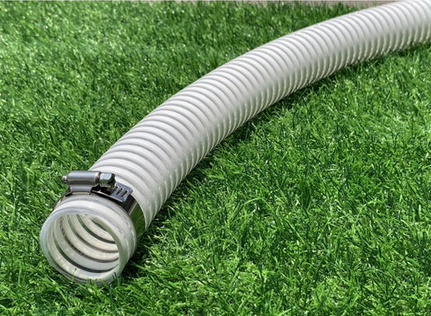 1.5 Inch Pool Replacement Hose For Above Ground Pools, flexible PVC vinyl, resting on grass, with UV resistant design and metal clamp