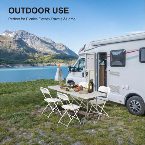 6 Ft Folding Table For Indoor And Outdoor Use Heavy Duty Plastic Foldable Dining Surface with chairs by a motorhome