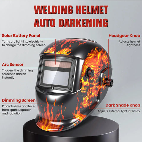 Auto Darkening Welding Helmet with Flaming Skull Design, showing solar panel and adjustable knobs, 3.66 x 1.69 inch view area.