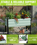 Galvanized Raised Garden Bed On Legs With Wheels For Easy Mobility, Elevated Planter Box Measures 37 By 14.6 By 31.6 Inches, 400 Lb Load Capacity Plus 100 Lb Bottom Shelf, Perfect For Garden, Backyard, Patio Or Deck, Light Green filled with plants in garden setting.